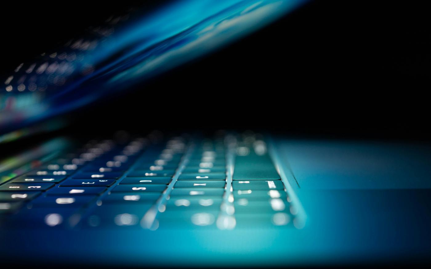 closeup photo of turned-on blue and white laptop computer by Philipp Katzenberger courtesy of Unsplash.
